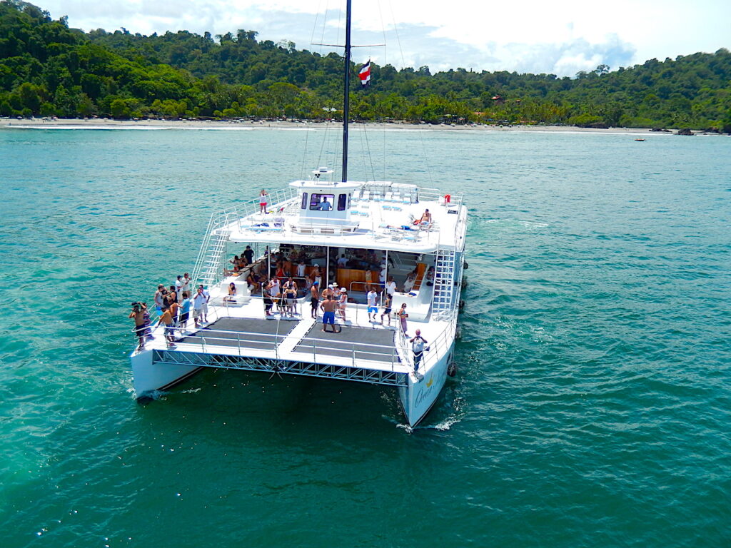 Catamaran sailing in the turquoise waters off Manuel Antonio
