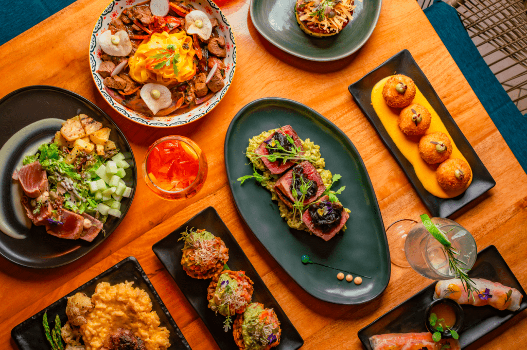 Table spread of ceviche, tacos and small plates at Medusa restaurant