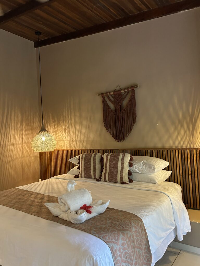 Jungle bungalow bed with bamboo headboard and macramé